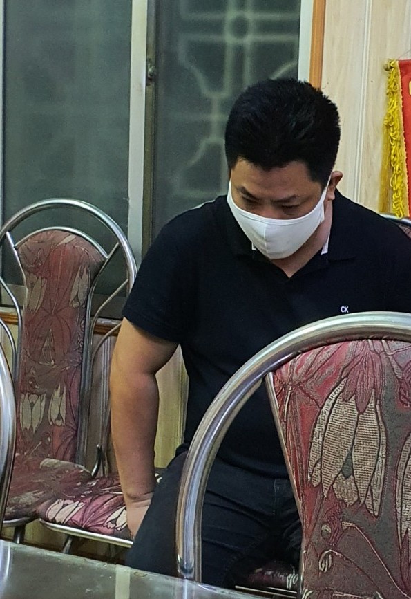 Phạm Phi Long khi bị bắt giữ tại cơ quan công an